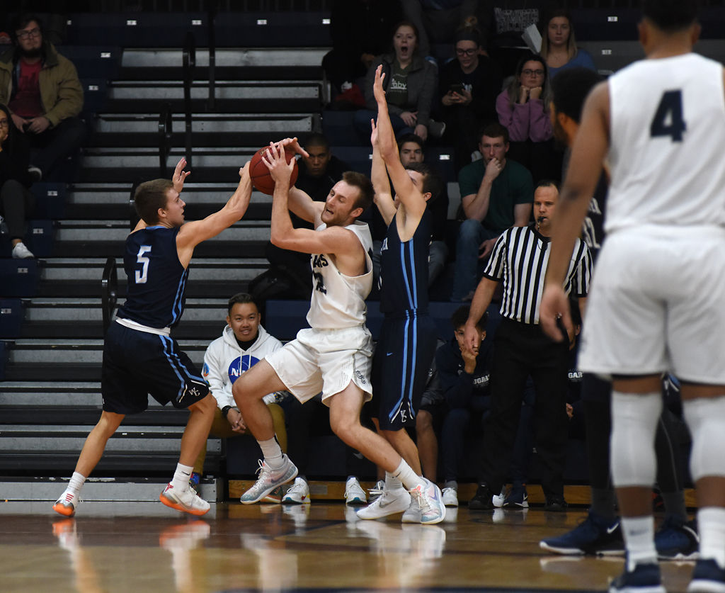 Kobe Wands tries to knock the ball out of Braden Wendel's hands